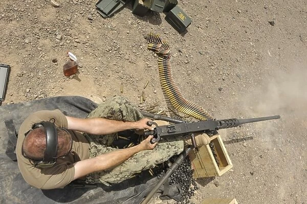Gunners Mate fires an M2. 50-caliber machine gun