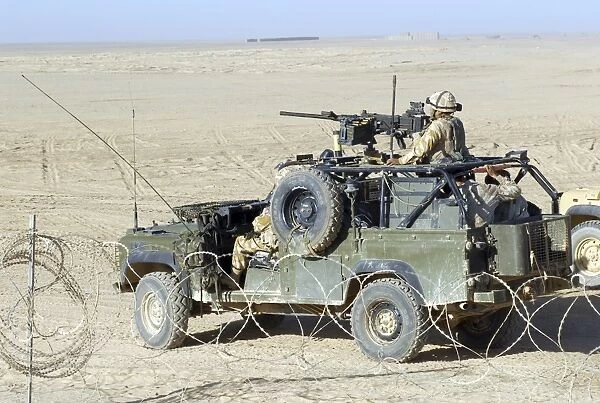 Gurkhas patrol Afghanistan in a Land Rover