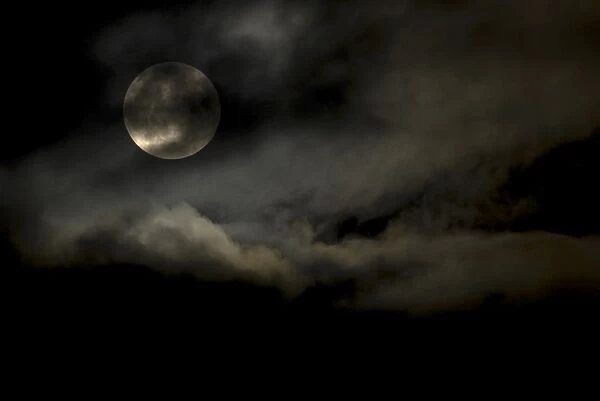 Harvest Moon through clouds