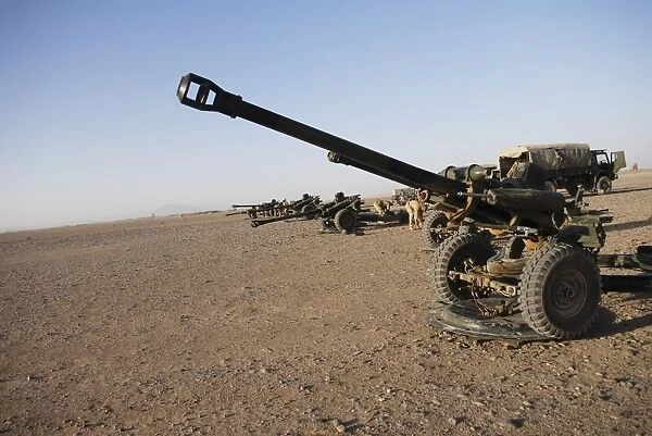 Howitzer 105mm light guns are lined up at Camp Bastion, Afghanistan