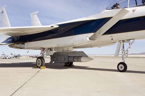 An inert AIM-54 Phoenix missile nestled under the fuselage of NASA Drydens F-15B