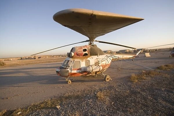 An Iraqi helicopter sits on the flight deck abandoned at Camp Warhorse