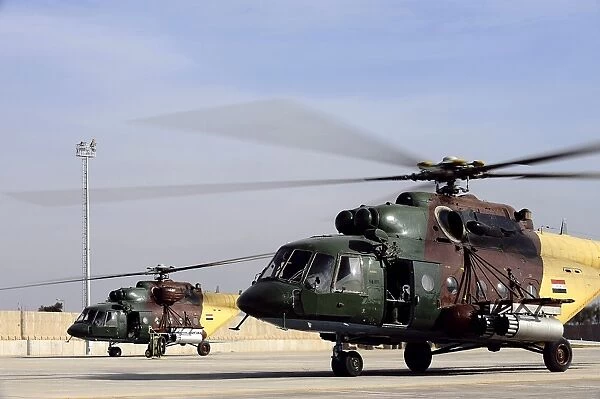 Two Iraqi Mi-17 Hip Helicopters conduct an aeromedical evacuation mission