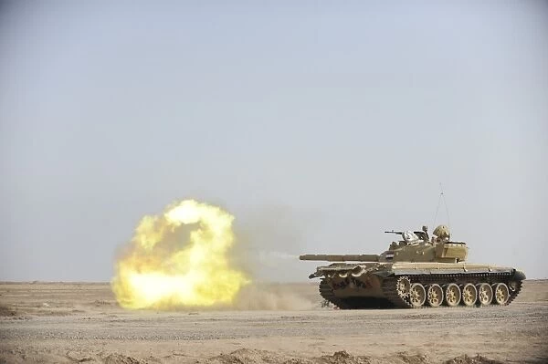 An Iraqi T-72 tank fires at the Besmaya Gunnery Range, Iraq
