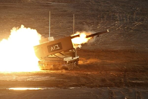 An Israel Defense Force Artillery Core MLRS launches a rocket