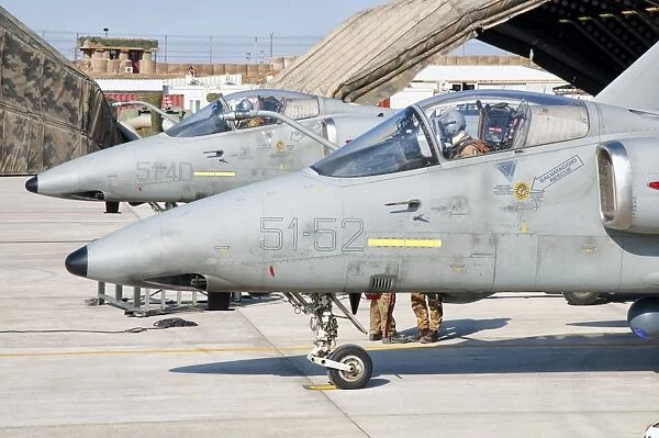 Italian Air Force AMX fighter aircraft are prepared for deployment