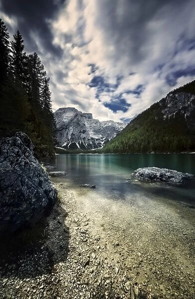 Lake Braies and Dolomite Alps against stormy clouds, Northern Italy