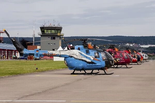 A line-up of 5 special colored Bo-105 helicopters of the German Army