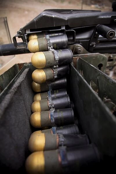 Linked 40mm rounds feed into a Mark 19 grenade launcher