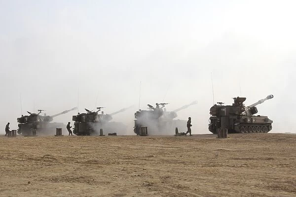 M109 self-propelled howitzers firing in the Negev Desert, Israel