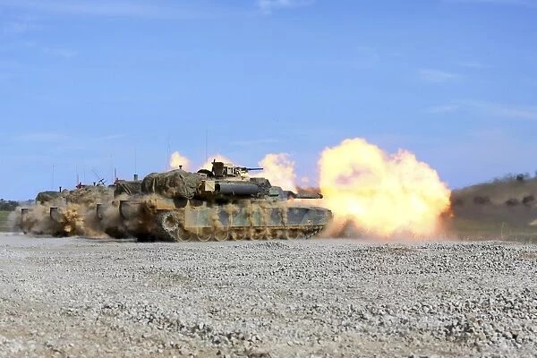 M1A1 Abrams fire their 120mm smoothbore cannon