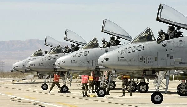 Maintainers perform pre-flight inspections on A-10 Thunderbolt II s