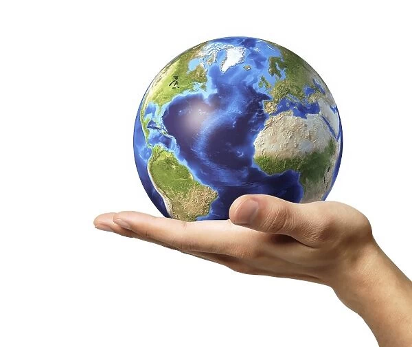 Male hand holding Earth globe
