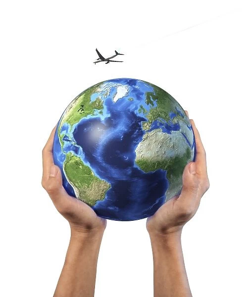 Mans hands holding the planet Earth, with a jet aircraft flying above