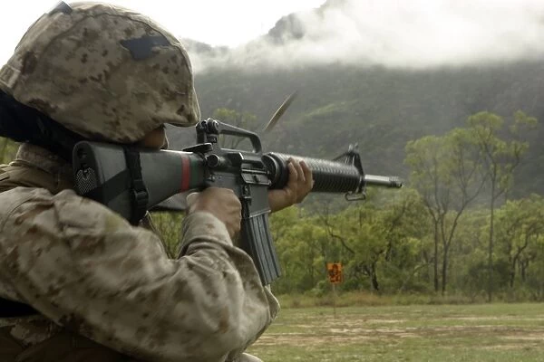 A Marine conducts drills with an M16-A2 service rifle