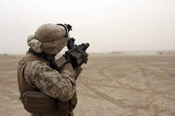 A Marine fires the M-32 Multiple shot Grenade Launcher