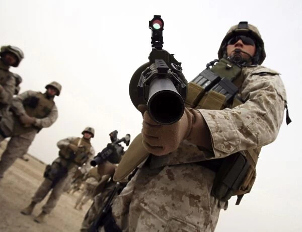 A marine holds the M-32 Multiple shot Grenade Launcher