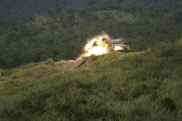 A Marine scores a direct hit while firing an AT-4 at an armored personnel carrier