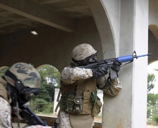 A Marine shoots at an enemy sniper