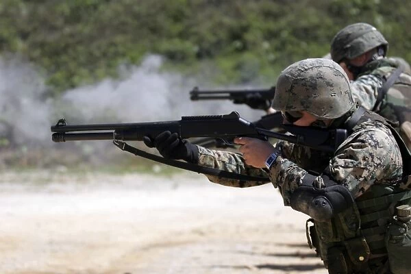 Marines firing shotguns