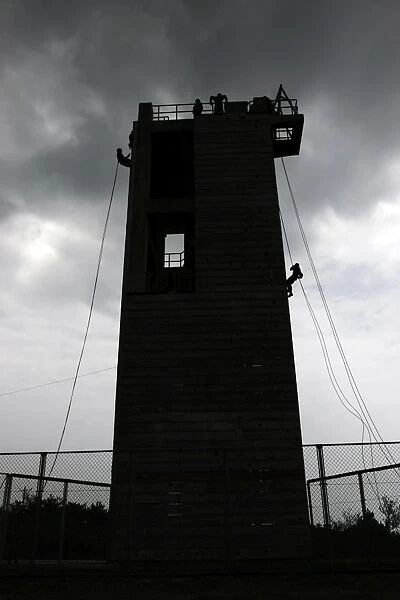 Marines rappel from the Camp Hansen Rappel Tower