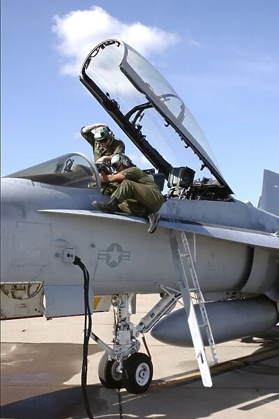 Marines run a systems test on an F  /  A-18 Hornet