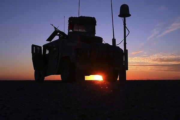 Marines take up a security position in a humvee