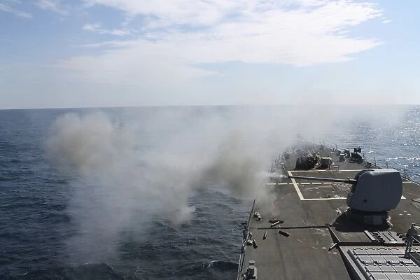 The Mark 45 lightweight gun is fired aboard USS Mahan