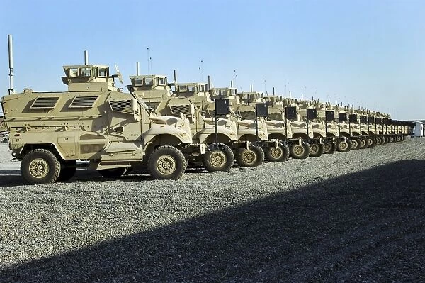 MaxxPro Mine Resistant Ambush Protected vehicles sit at Camp Liberty