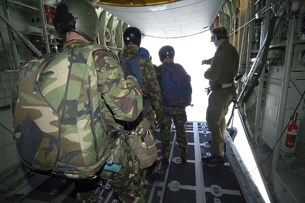 Members of the Pathfinder Platoon wait for parachute jump training aboard a C-130