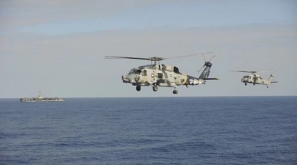 Two MH-60 Sea Hawk helicopters during an air demonstration