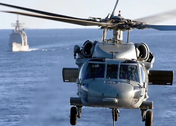 An MH-60S Seahawk helps conduct a vertical replenishment