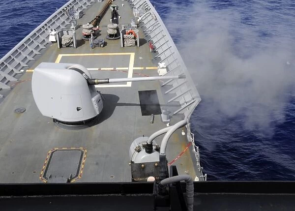 A Mk-45 5-inch. 54-caliber gun is fired aboard USS Cowpens