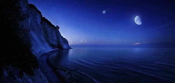 Moon rising over tranquil sea and Mons Klint cliffs, Denmark
