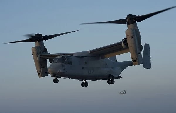 An MV-22 Osprey prepares to land on the flight deck of USS Anchorage