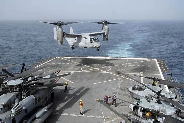 An MV-22B Osprey lands aboard the amphibious transport dock ship USS Mesa Verde