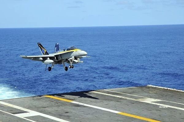 n F  /  A-18C Hornet lands aboard the aircraft carrier USS Ronald Reagan