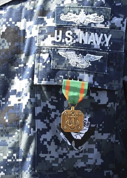 A Navy and Marine Corps Achievement Medal adorns the U. S. Navy uniform
