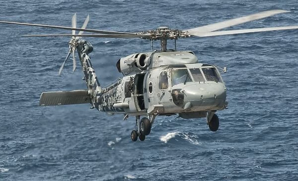 A US Navy SH-60F Seahawk flying off the coast of Pakistan