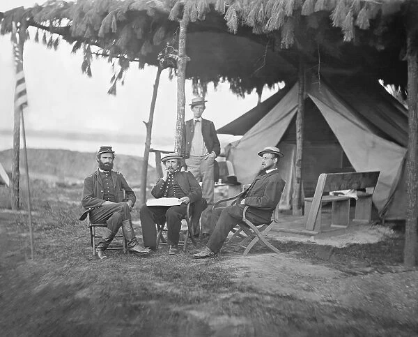 Officers from the 5th U. S. Cavalry Regiment sitting outside their tent during the