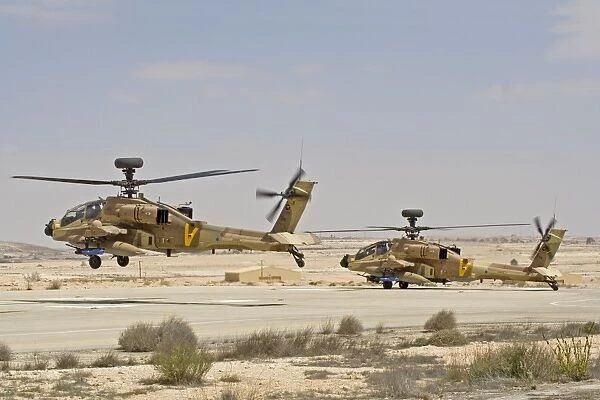 A pair of AH-64D Saraf attack helicopters of the Israeli Air Force