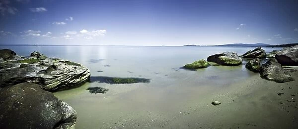 Panoramic view of tranquil sea and boulders against blue sky, Burgas, Bulgaria