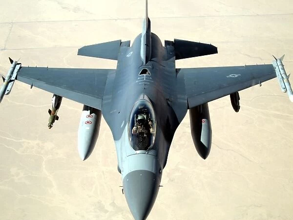 Pilot gives a thumbs up after successfully refueling his F-16 Fighting Falcon