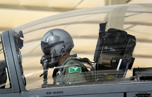 Pilot makes final pre-flight checks on an F-15E Strike Eagle