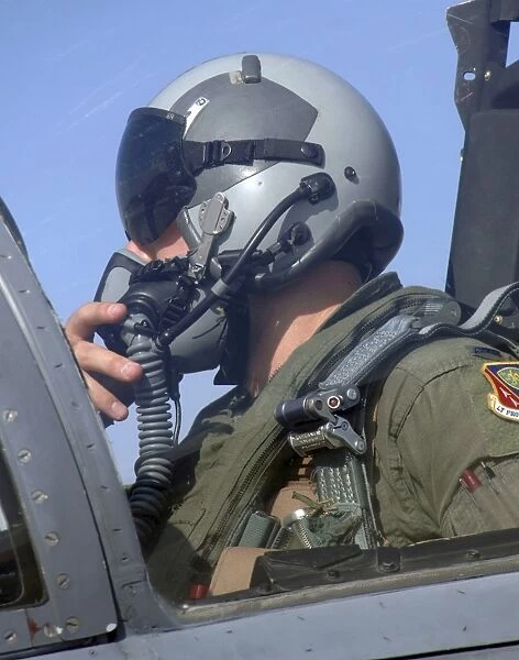 Pilot prepares to taxi out for a mission in a F-15 Eagle
