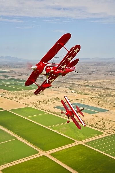 Two Pitts Special S-2A aerobatic biplanes in flight near Chandler, Arizona