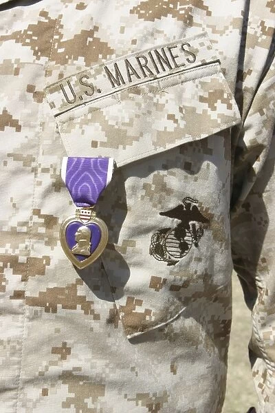 The Purple Heart award hangs over the heart of a U. S. Marine