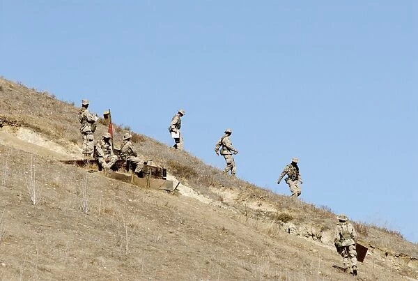 Recruits descend one of many hills to track down a far-away checkpoint