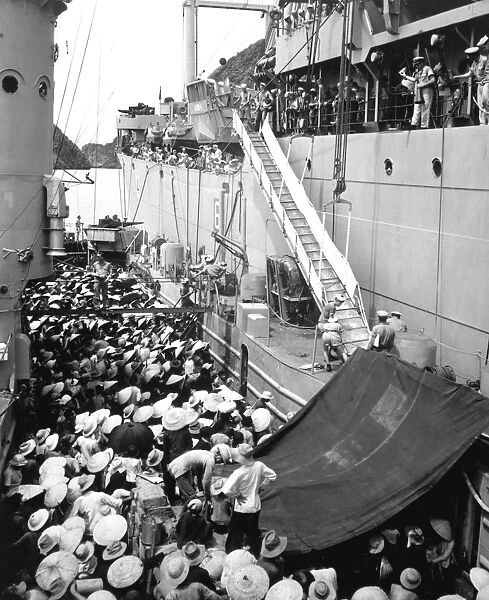 Refugees wait to board a ship in Haiphong, Vietnam, 1954