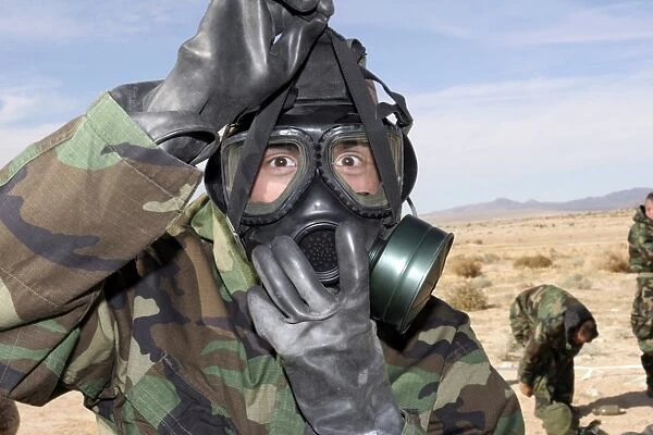 Rifleman puts on his gas mask